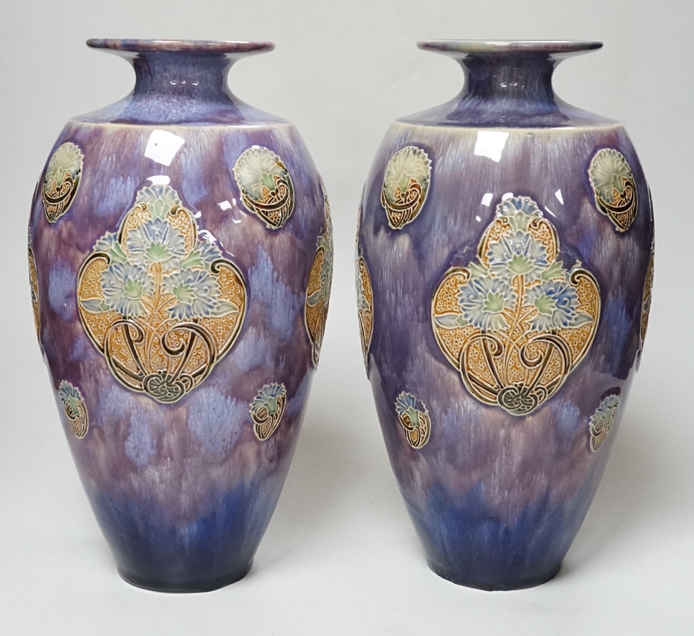 A pair of Doulton stoneware vases by Florie Jones, 31cm